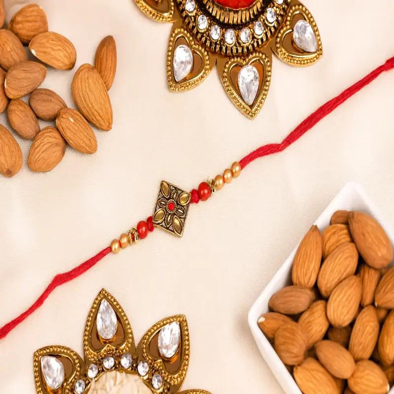 Antique Kundan Rakhi and Almonds - Gifts gift from Buy Any Flowers Dubai in Al Quoz Industrial Area 4, Dubai, UAE