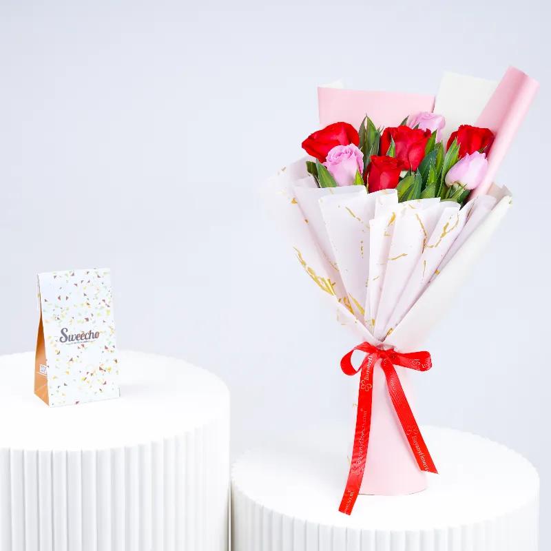 Cutie Pie 7 Roses Bouquet and Sweecho Chocolates 100gm - Gift Sets gift from Buy Any Flowers Dubai in Al Quoz Industrial Area 4, Dubai, UAE