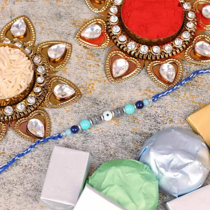 Evil Eye Rakhi and Assorted Chocolates 100gm