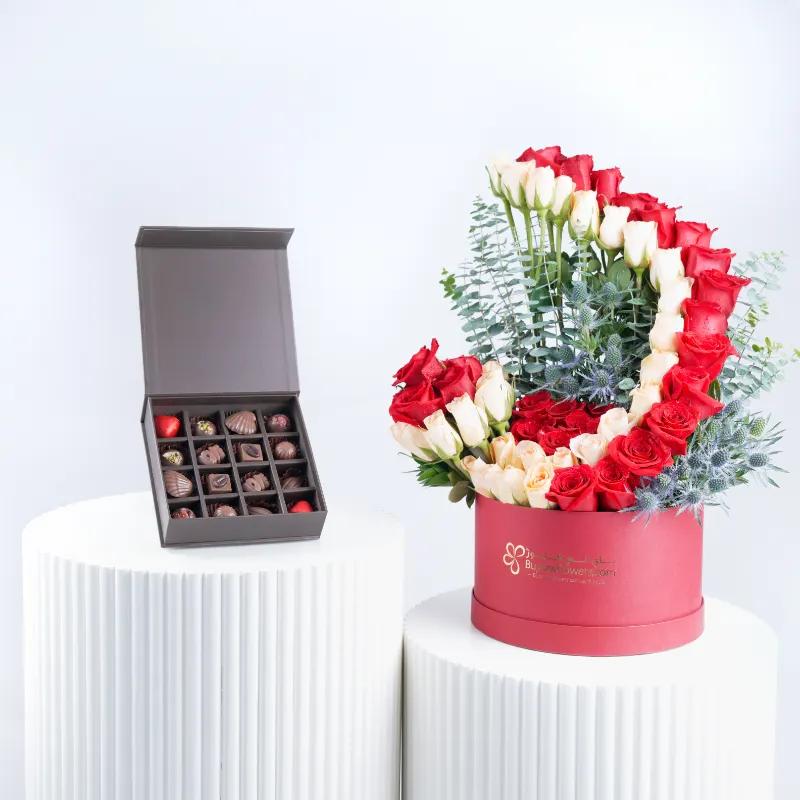 Velvet Blush 65 Roses in Box and Chocolates - Gift Sets gift from Buy Any Flowers Dubai in Al Quoz Industrial Area 4, Dubai, UAE