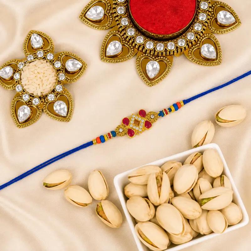 Designer Kundan Rakhi and Pistachio - Gifts gift from Buy Any Flowers Dubai in Al Quoz Industrial Area 4, Dubai, UAE