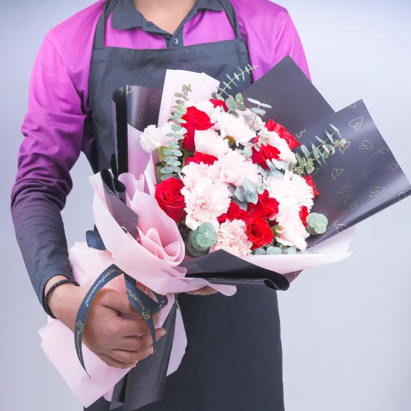 Queen 21 Red Roses and Pink Carnations Bouquet - Flowers gift from Buy Any Flowers Dubai in Al Quoz Industrial Area 4, Dubai, UAE - image 2