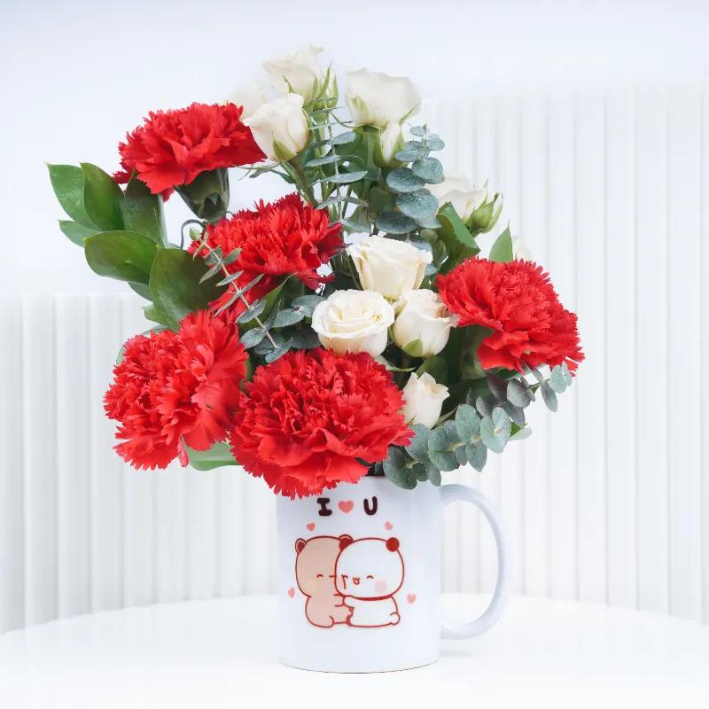 Thought 7 Carnation and Roses in Mug With Teddy - Gift Sets gift from Buy Any Flowers Dubai in Al Quoz Industrial Area 4, Dubai, UAE - image 2
