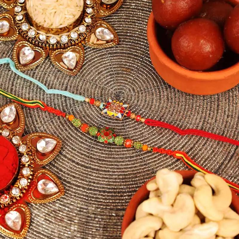 Kundan and Antique Rakhi with Tin Gulab Jamun and Cashews - Gifts gift from Buy Any Flowers Dubai in Al Quoz Industrial Area 4, Dubai, UAE