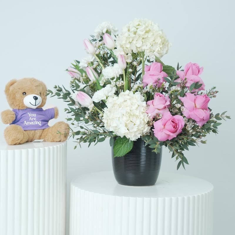 Elegance Flowers in Black Ceramic Pot and Teddy - Gift Sets gift from Buy Any Flowers Dubai in Al Quoz Industrial Area 4, Dubai, UAE