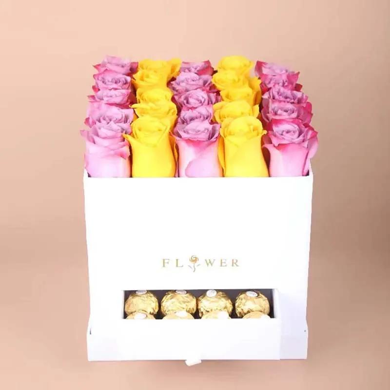yellow-n-purple-roses-in-white-square-box_1.webp