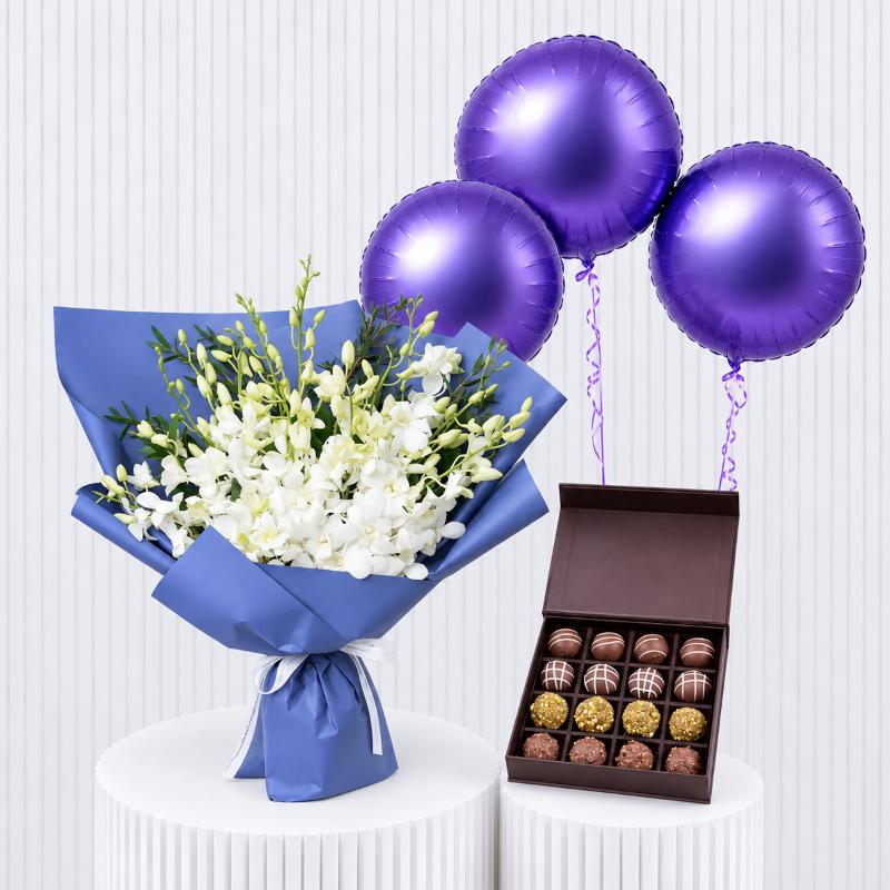 White Orchids with Chocolates and Balloons - Gift Sets gift from Buy Any Flowers Dubai in Al Quoz Industrial Area 4, Dubai, UAE