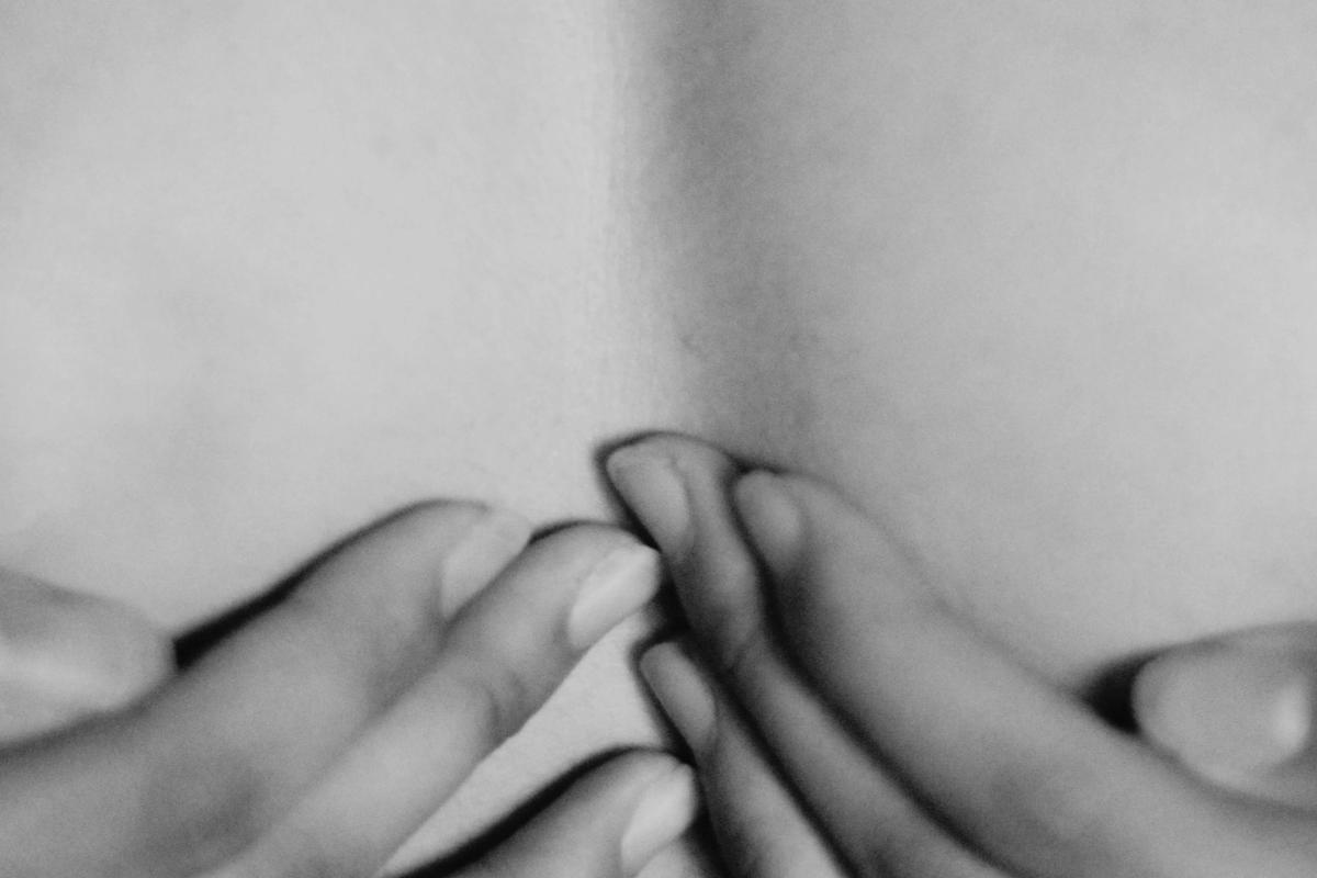 A woman's hands on her chest