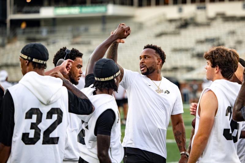 Coach Brennan Marion with players at Bobby Dodd Stadium