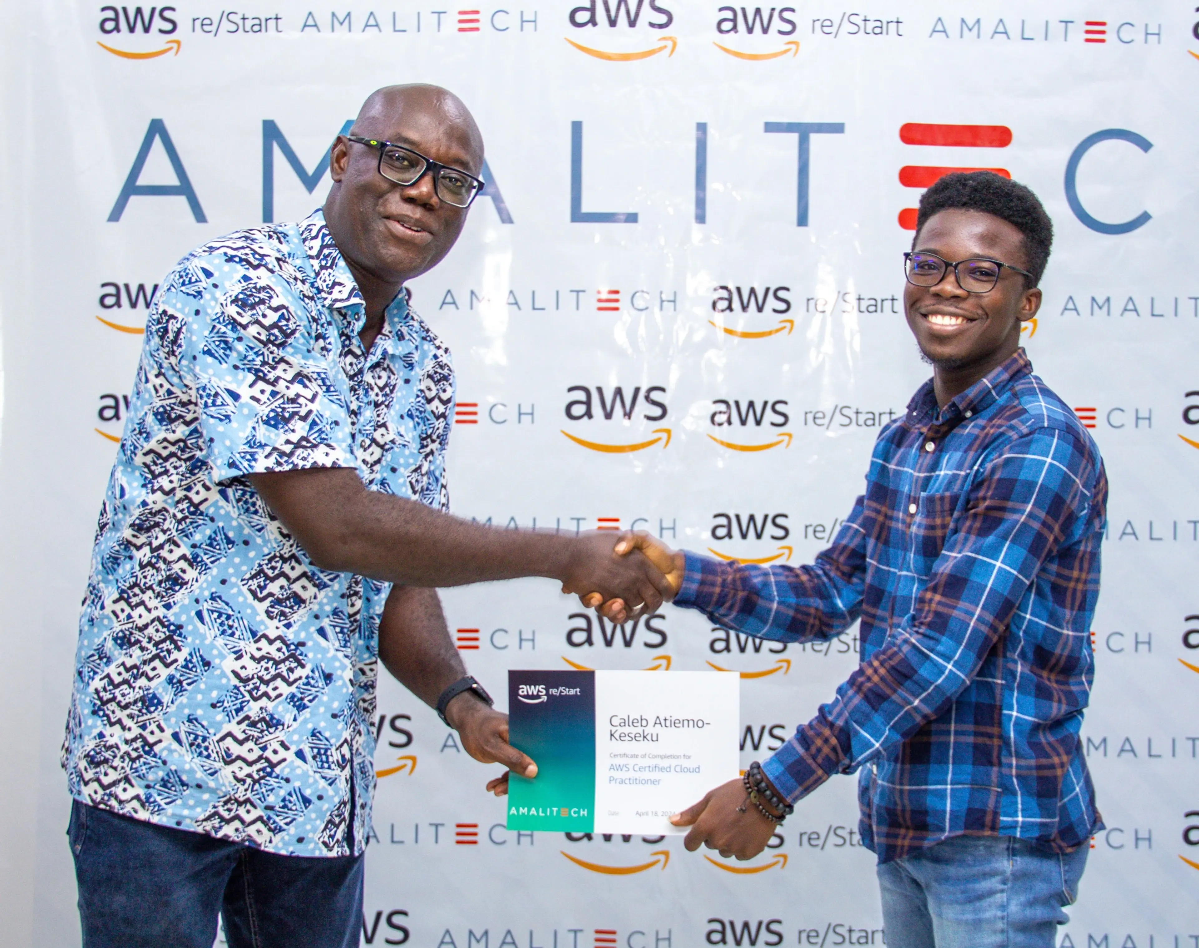 Our Senior Principal awarding a developer his AWS/Restart Programme certificate.