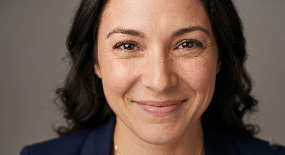 Close-up headshot example showing natural engaged expression with slight eye squint and relaxed jaw