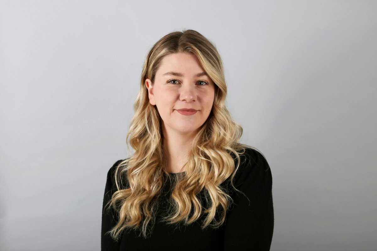 LinkedIn headshot example of white woman on a bright neutral background