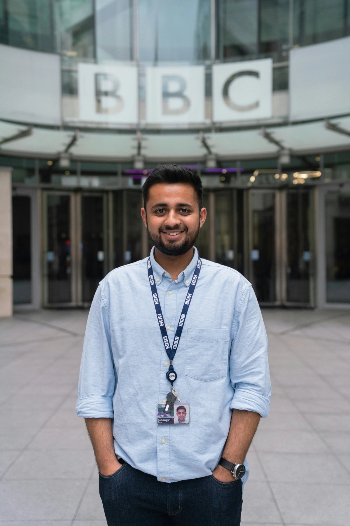 a person standing outside of BBC office