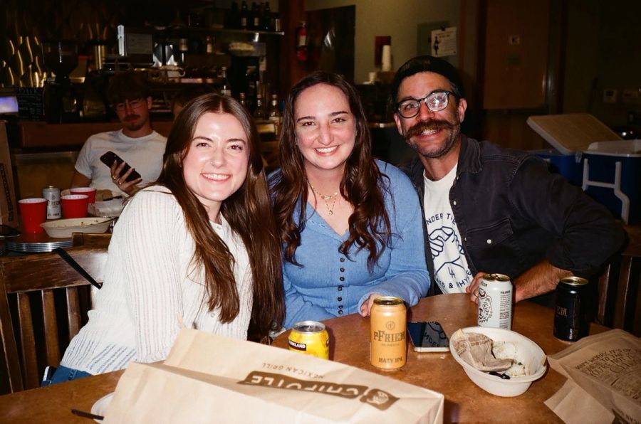 Three Sproutbox teammates at a table during a team night out