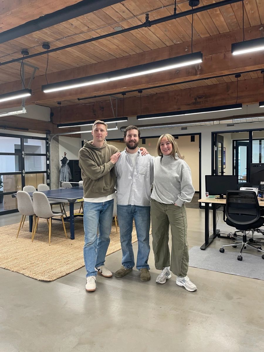 Three Sproutbox teammates standing together in the office
