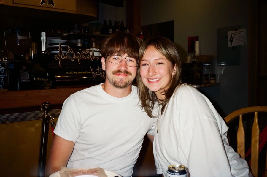 Two Sproutbox teammates smiling together at a bar