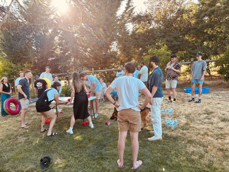 Sproutbox team playing yard games at a sunny backyard summer party