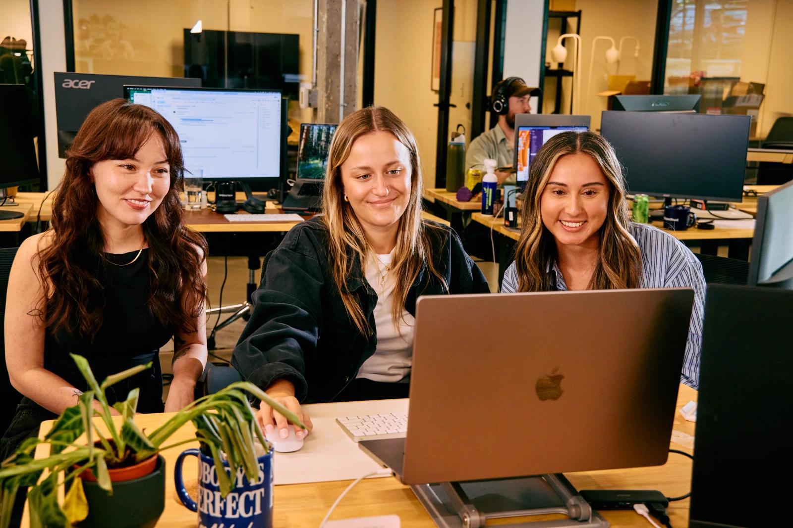 Sproutbox team members working together in our Portland office