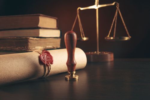 scales of justice and legal documents