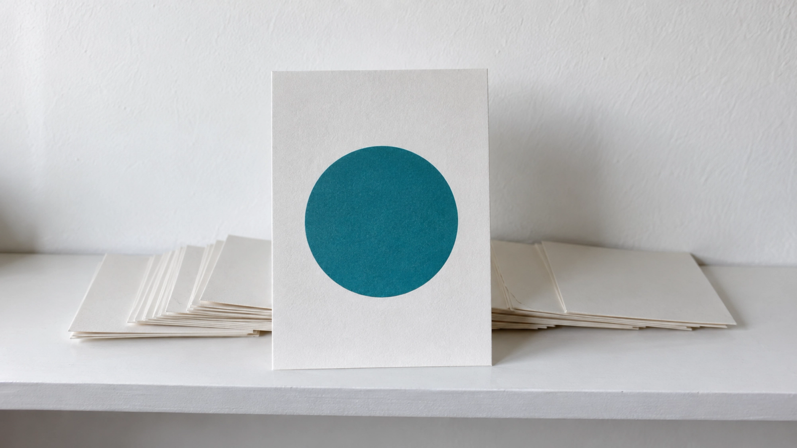 Every post is seen alone. Write it that way. One postcard standing on its own in front of cards lying face down, illustrating AI social media posts that stand alone