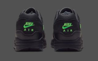 Heel angle of Nike's Air Max 1 in a "Black/Green Strike" color scheme.