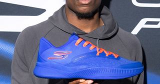 New York Knicks player OG Anunoby's "NYC Blue" Skechers Basketball SKX_Nexus shoe in a blue-and-orange color scheme, available for pre-order.