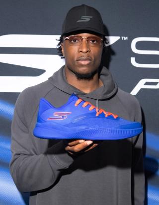 New York Knicks player OG Anunoby's "NYC Blue" Skechers Basketball SKX_Nexus shoe in a blue-and-orange color scheme, available for pre-order.