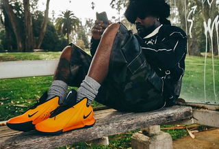 Wale wearing Nike Basketball's G.T. Future in its "Fire" color scheme.