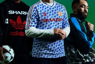 Amad Diallo, Lisandro Martínez & Matheus Cunha modeling Man United's 1990-92 adidas Bring-Back Collection.