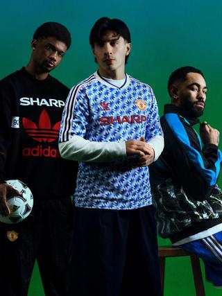 Amad Diallo, Lisandro Martínez & Matheus Cunha modeling Man United's 1990-92 adidas Bring-Back Collection.