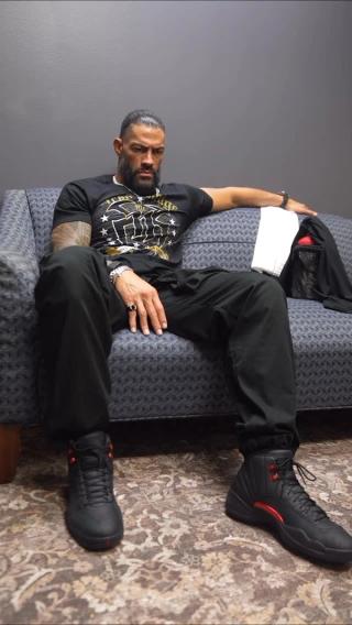 WWW Wrestler "Roman Reigns" wearing the "Bloodline" Air Jordan 12. Photo via Roman Reigns.