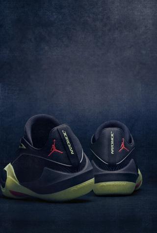 Jordan Triangle basketball shoe in a "Volt/Infrared" color scheme.