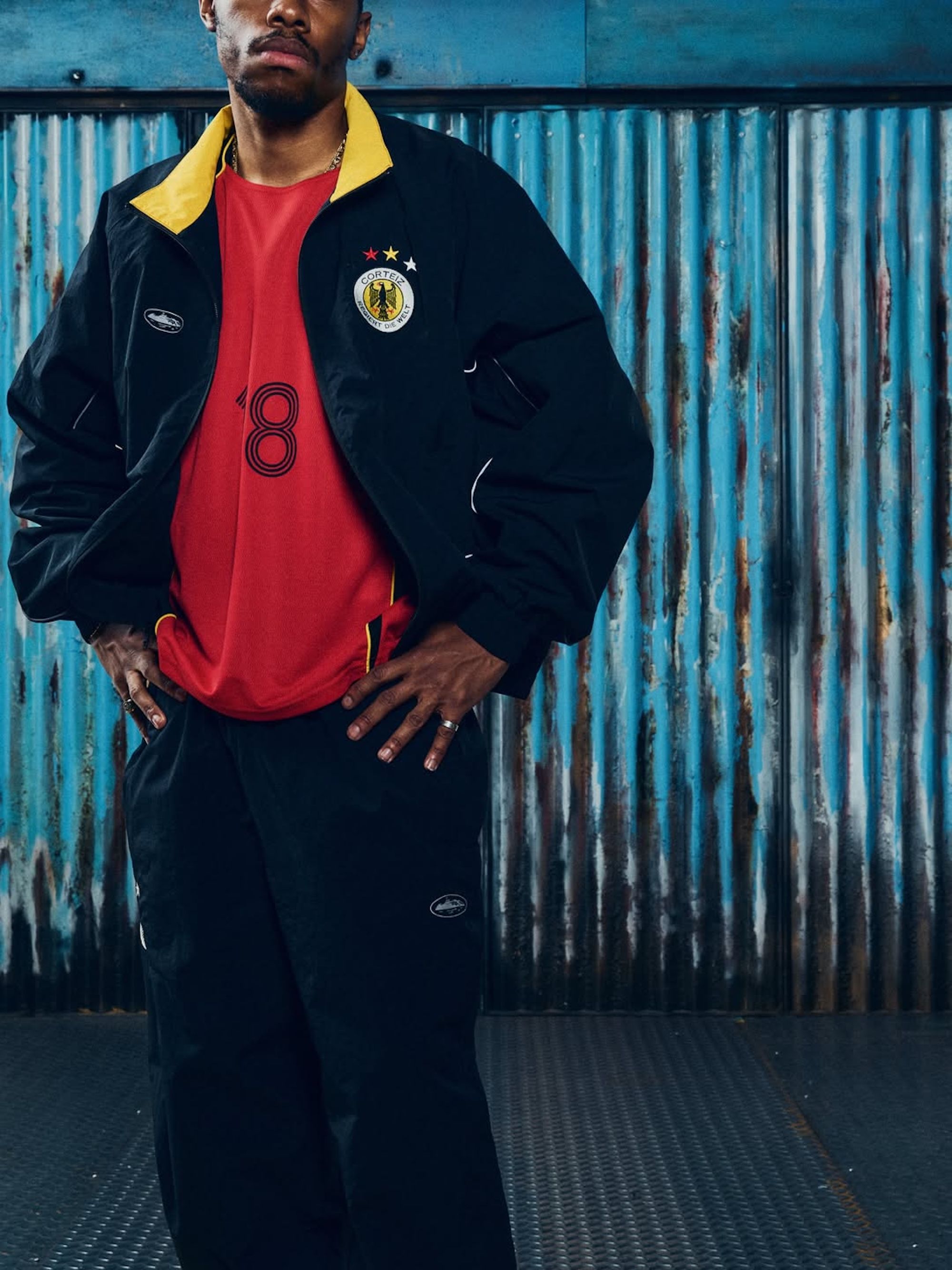 Germany-inspired tracksuit & jersey combinations by Corteiz. Photo via Corteiz.