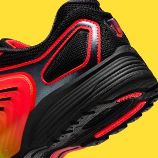 Heel close-up of Nike's Pegasus Wave in a "Black/Bright Crimson/Green Strike" color scheme.