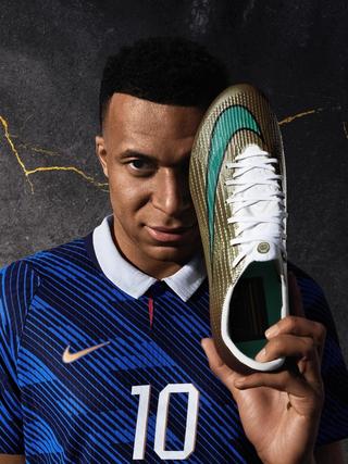 Kylian Mbappé with his golden Nike Mercurial Superfly 11. Photo via Nike.