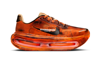 Nike Running's Vomero Premium in a "Black/Hot Lava/Anthracite/Sapphire" color scheme.