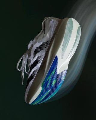 Pharrell Williams' Humanrace x adidas Adizero EVOlution in a "White/Black" color scheme.