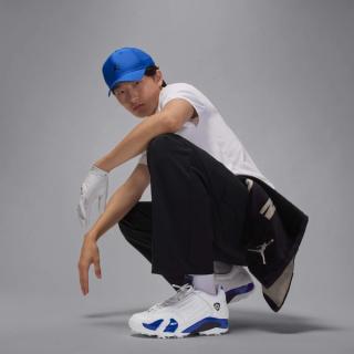 Model wearing the Air Jordan 14 Golf shoe in a "White/Hyper Royal/Black" color scheme.