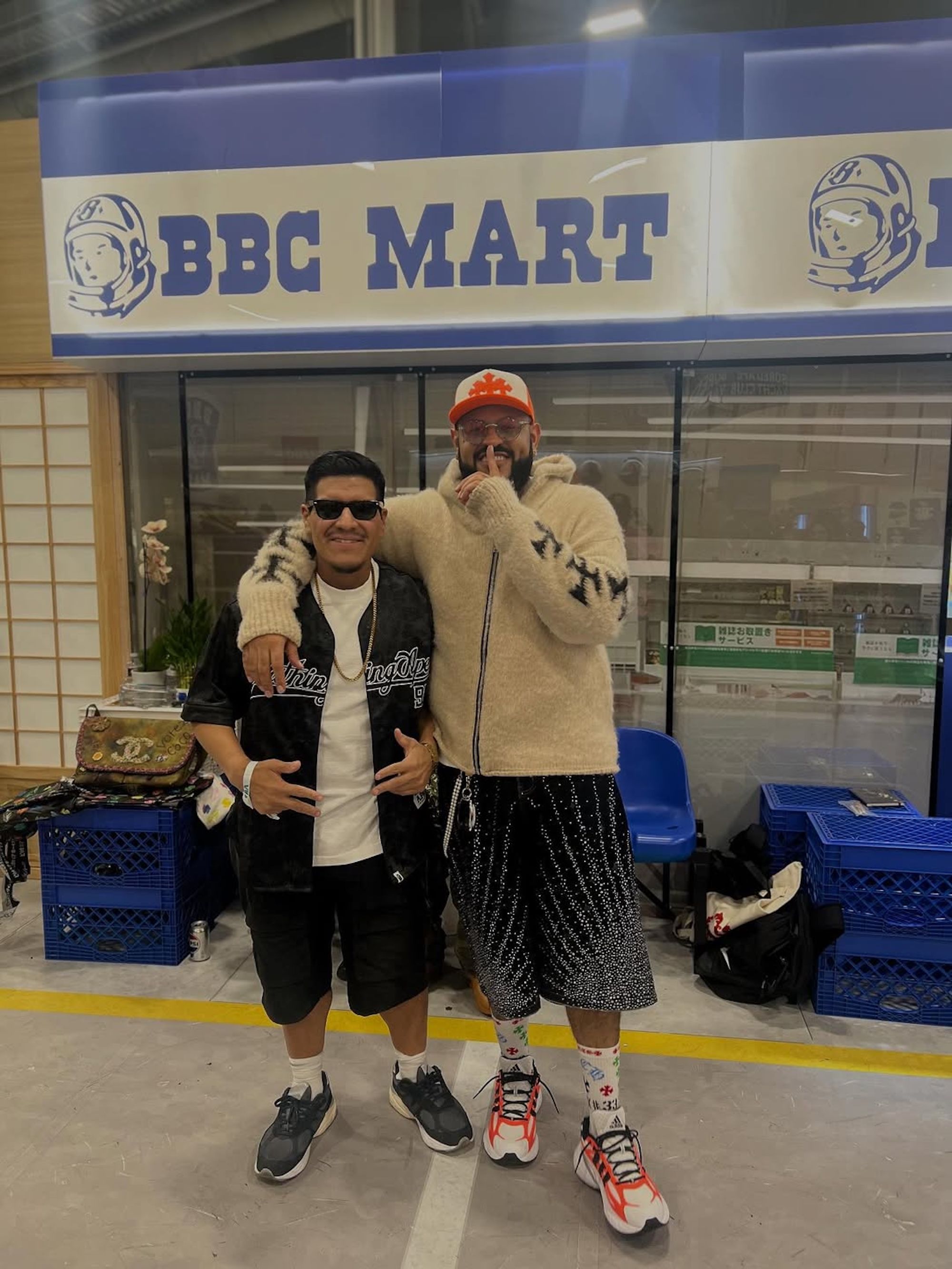 Upscale Vandal (right) wearing the Adidas Adistar Squid "White/Solar Orange." Photo via @miqtrakz on Instagram.