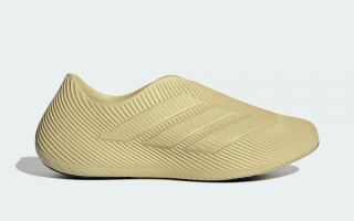 Adidas Purechill recovery slip-on in a "Gold Beige/Gold Beige/Core Black" color scheme.