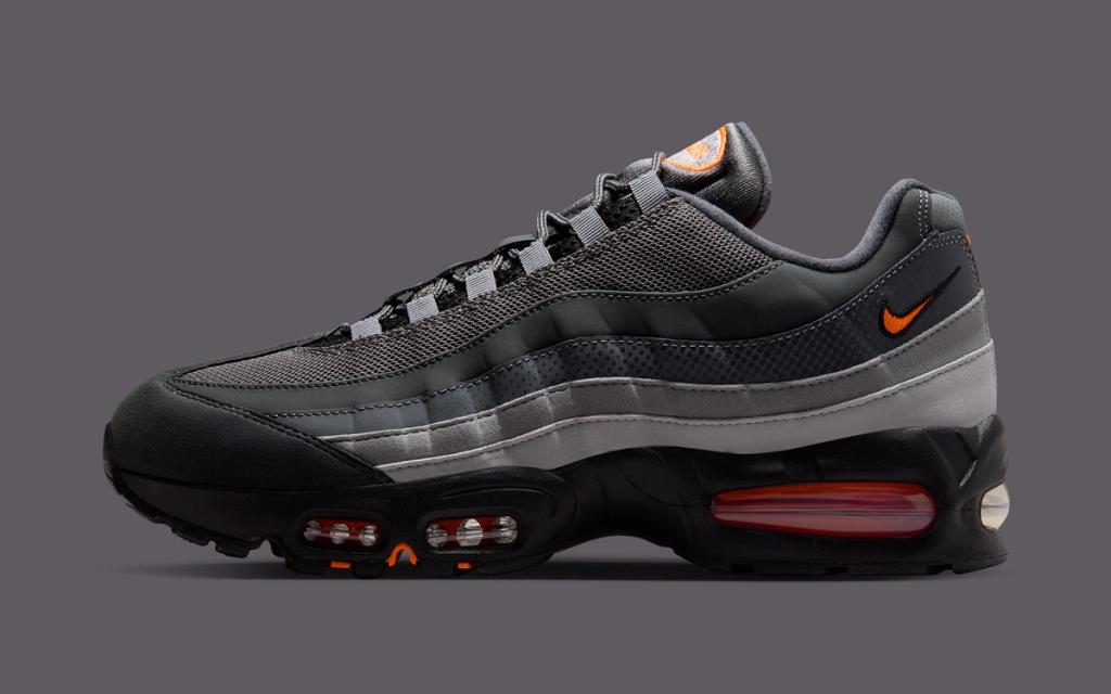 Nike Air Max 95 Total Orange colorway showing visible Air cushioning and exaggerated ankle collar