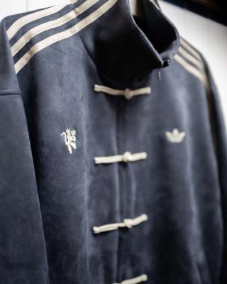 Manchester United players wearing custom viral adidas Chinese New Year Jacket in grey on May 9, 2026.