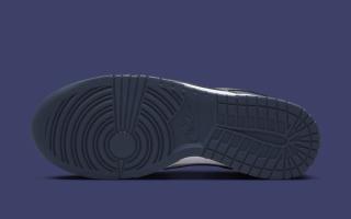 Outsole angle of Women's Nike Dunk Low covered in a "White/Thunder Blue" color scheme.
