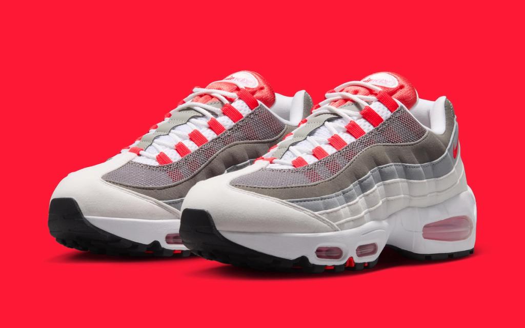 Women's Nike Air Max 95 in White and Light Crimson colorway, showcasing the model's layered construction and visible Air unit