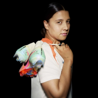 Sam Kerr holding her own Nike Mercurial Superfly 10 Elite football boot.