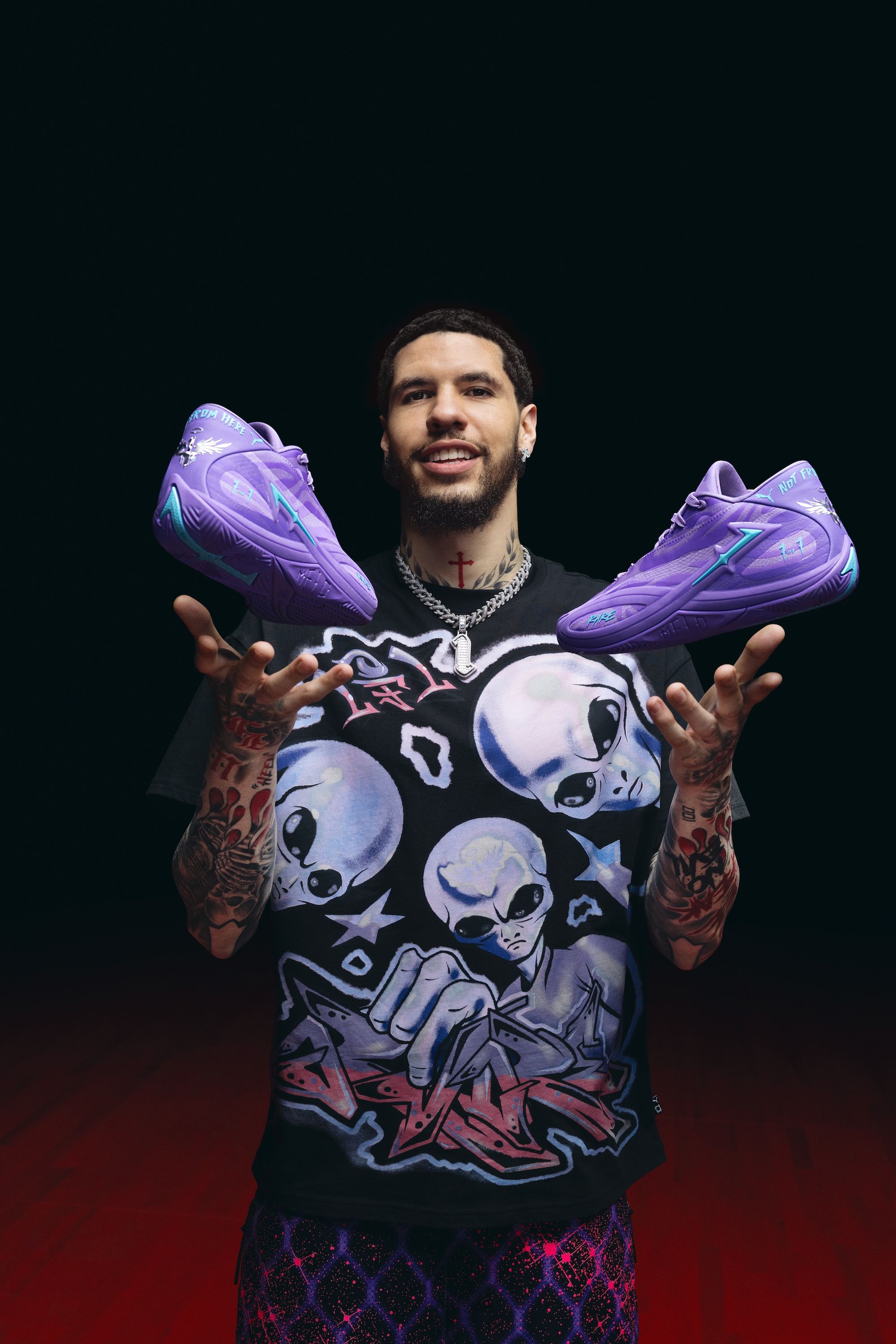 LaMelo Ball with his PUMA MB.06 "Shooting Star" basketball shoe in a purple colorway.