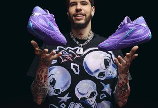 LaMelo Ball with his PUMA MB.06 "Shooting Star" basketball shoe in a purple colorway.