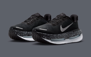 Women's pair of the Nike Vomero Premium in an Oreo-reminiscent "Black/White/Metallic Silver" color scheme, complete with speckled detailing on the midsole.