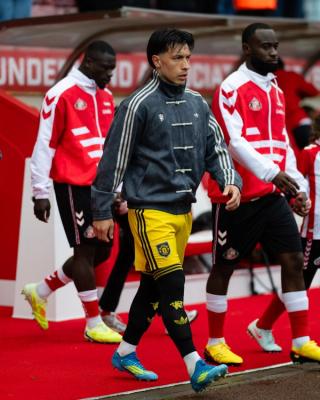 Manchester United players wearing custom viral adidas Chinese New Year Jacket in grey on May 9, 2026.