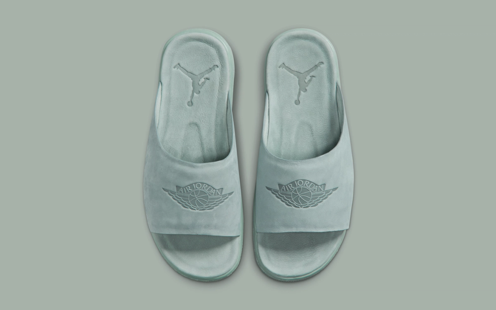 Women's Jordan Modero 1 Slide in neutral colorway, showcasing contoured footbed and soft upper construction